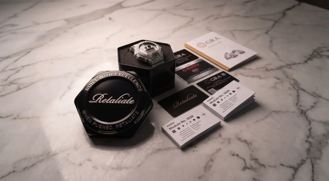 Retaliate iced out G-Shock DW6900 with GRA certified documentation and packaging on marble