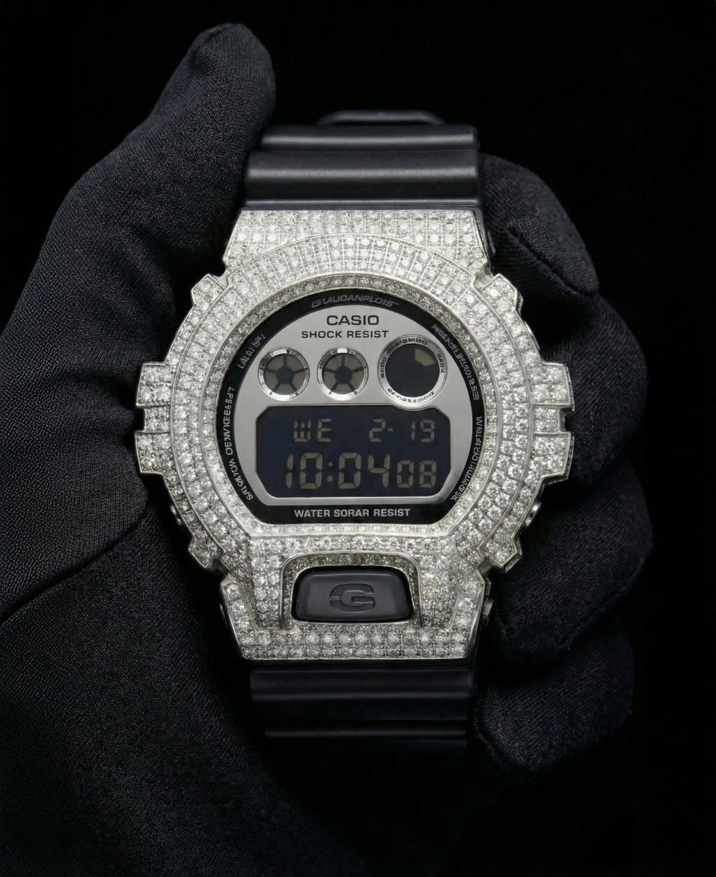 Retaliate iced out gshock mod with vvs1 diamonds in black and silver with black band, front view.
