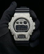 Retaliate iced out gshock mod with vvs1 diamonds in black and silver with black band, front view.