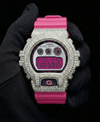 Retaliate iced out gshock diamond mod with vvs1 stones in pink and silver with pink band, front view.