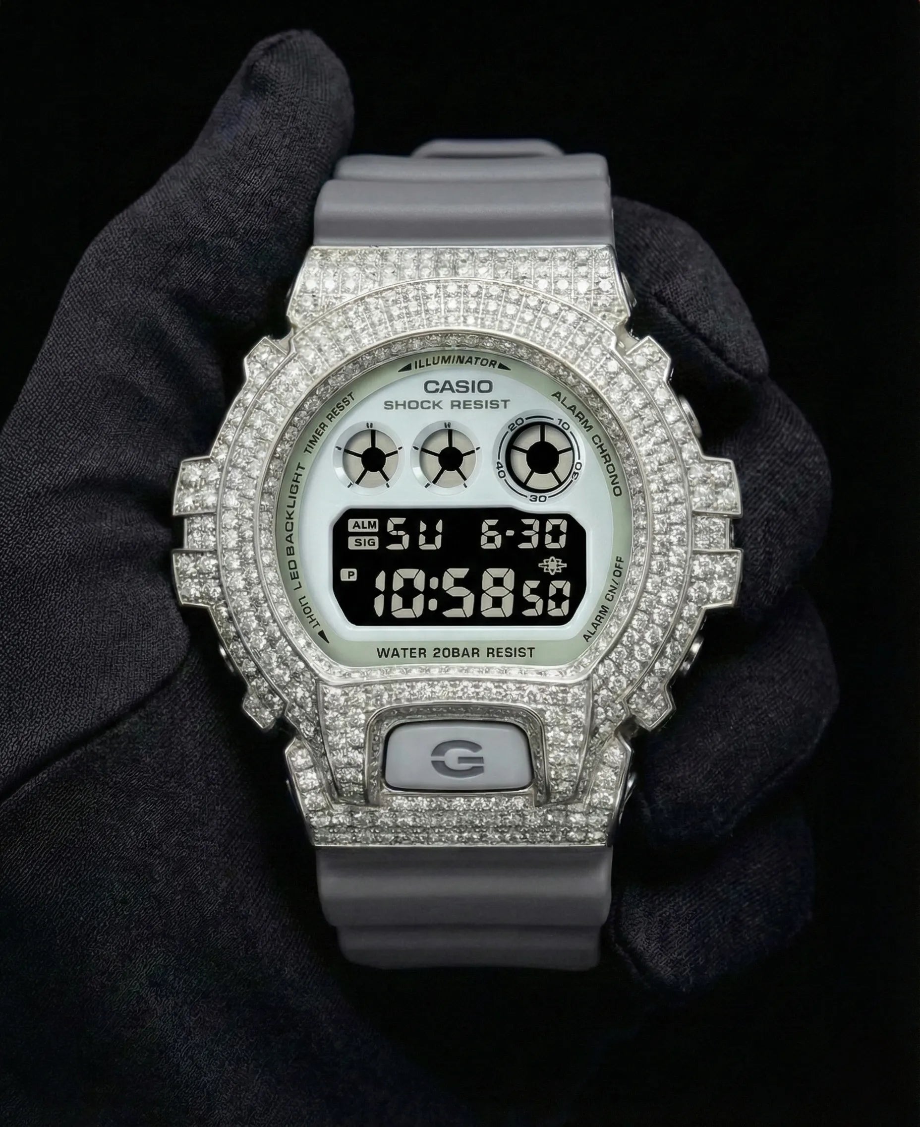 Retaliate iced out gshock diamond mod with vvs1 stones in grey and silver with grey band, front view.