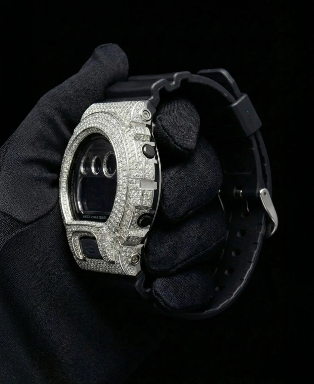 Retaliate iced out gshock mod with vvs1 diamonds in black and silver with black band, side view.