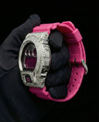 Retaliate iced out gshock diamond mod with vvs1 stones in pink and silver with pink band, side view.