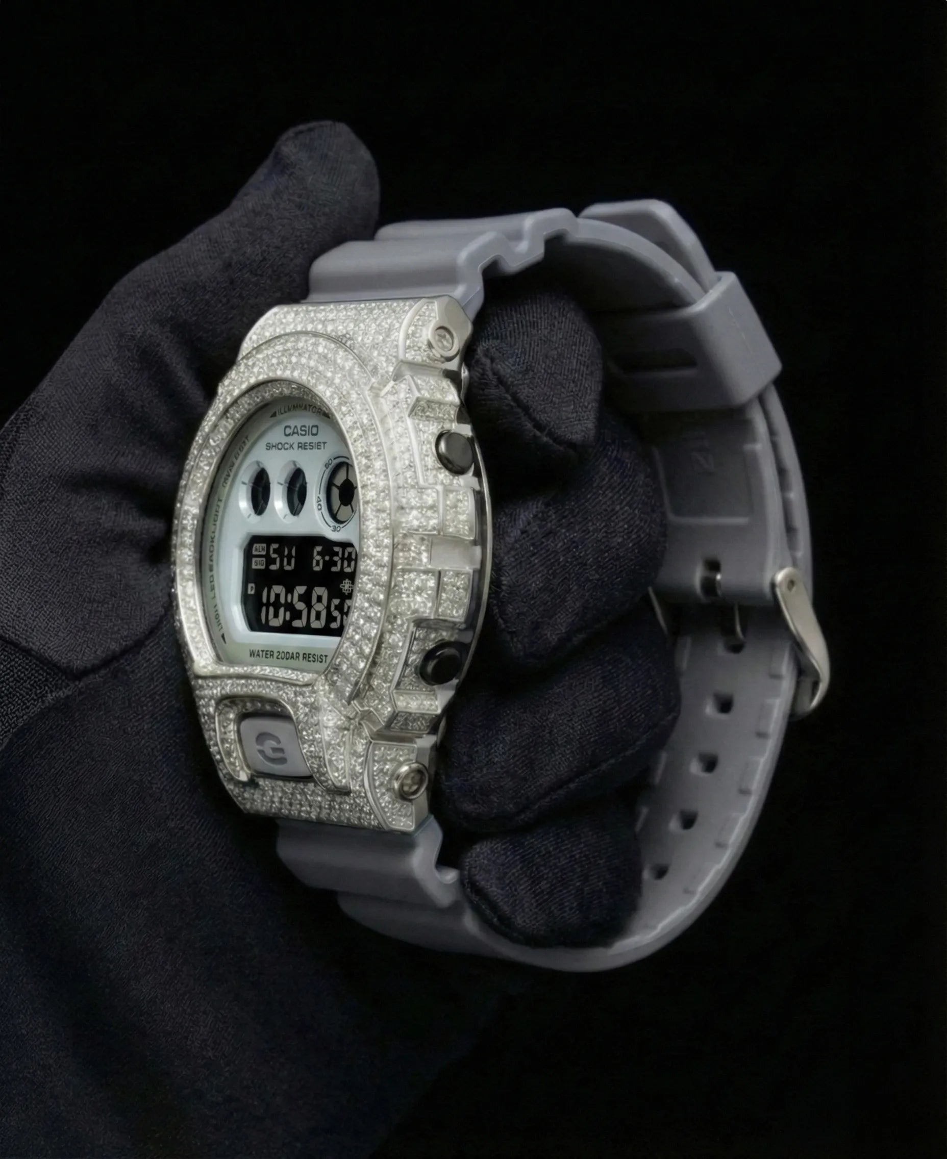 Retaliate iced out gshock diamond mod with vvs1 stones in grey and silver with grey band, side view.
