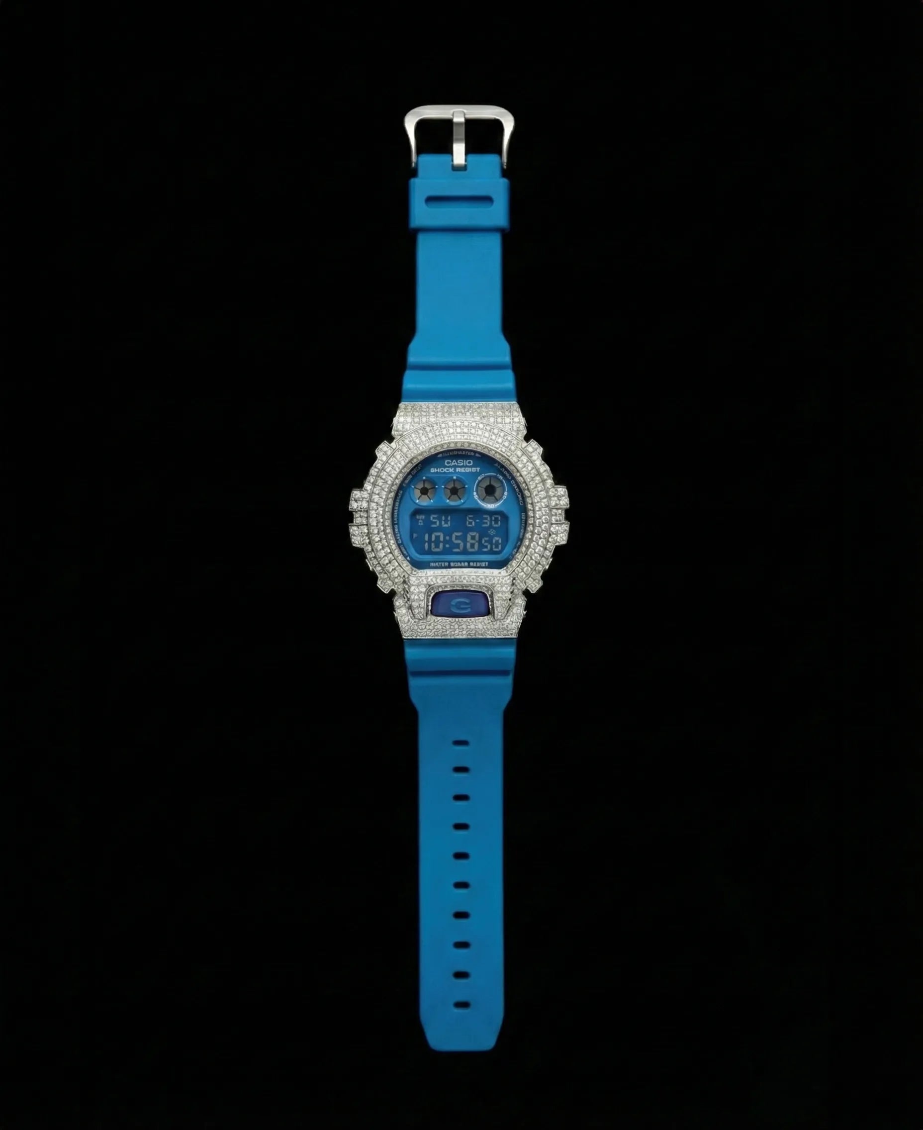 Retaliate iced out gshock mod with vvs1 diamonds in blue with a blue band, up close, full view.
